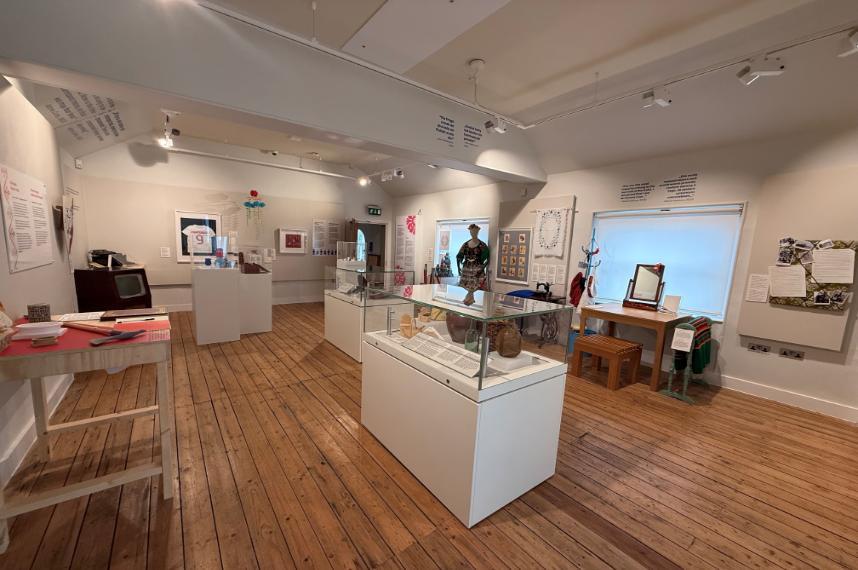 wide angle shot of the Polish Exhibition with artefacts and artwork on the walls and in cases